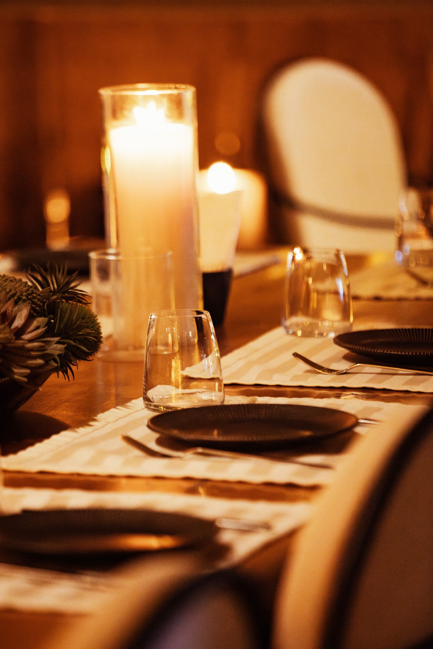 Candlelit table set for a private clubhouse gathering