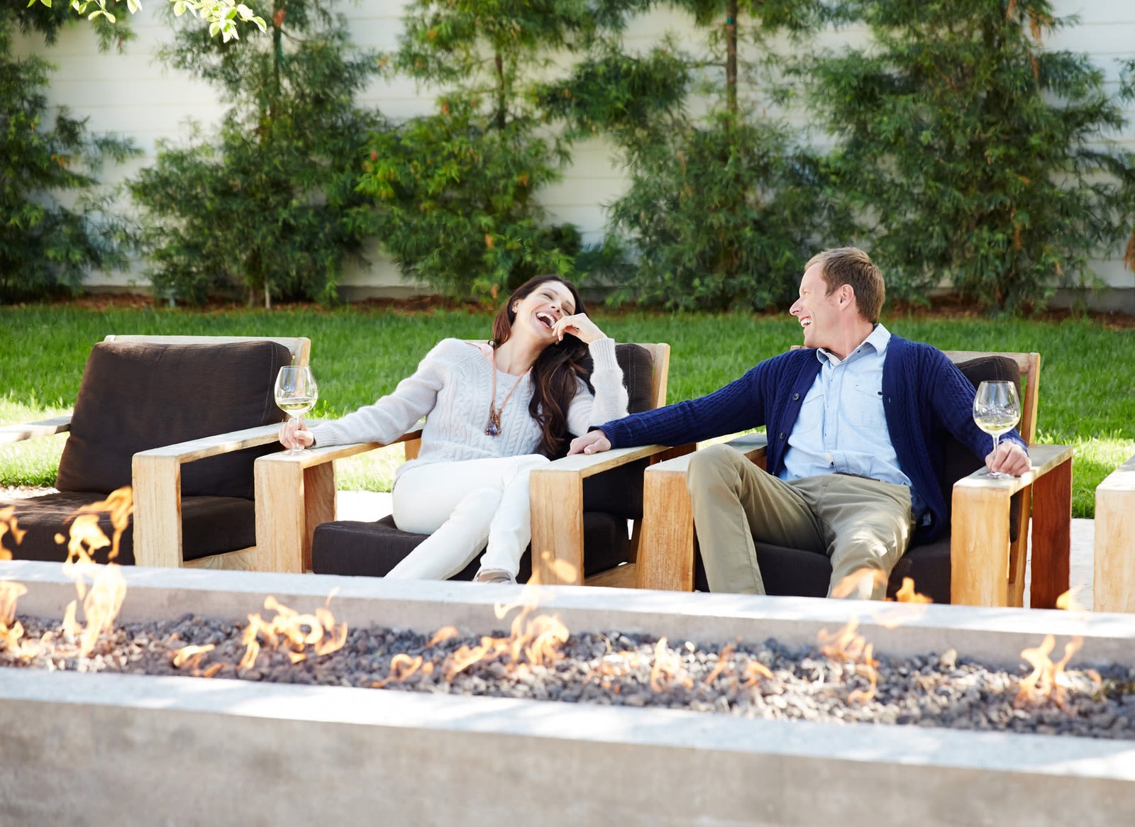 Outdoor fire pit lounge with wood seating