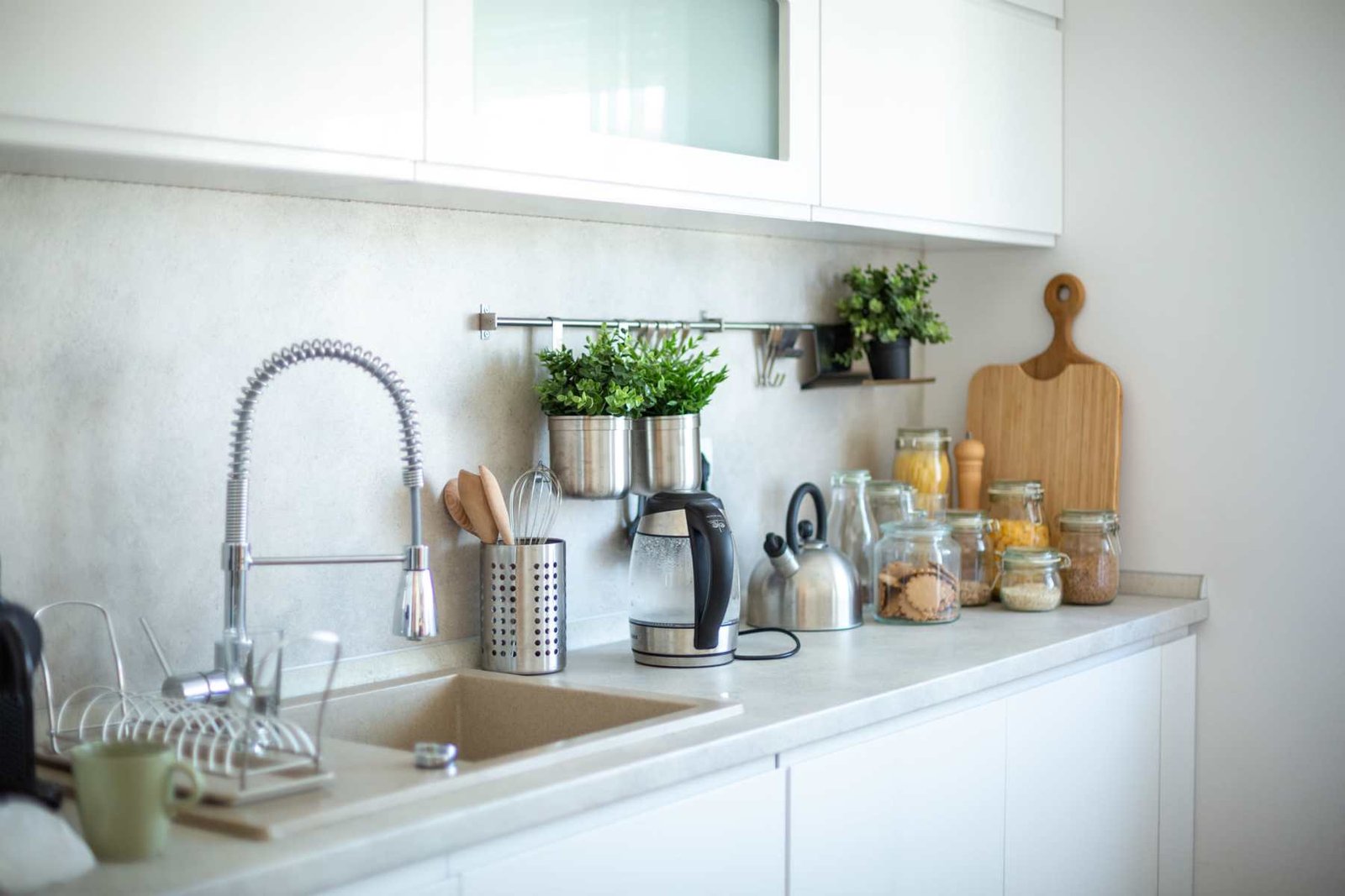 Apartment kitchen with stainless-steel appliances and custom cabinetry